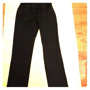 Black career work pants with two front pockets.
